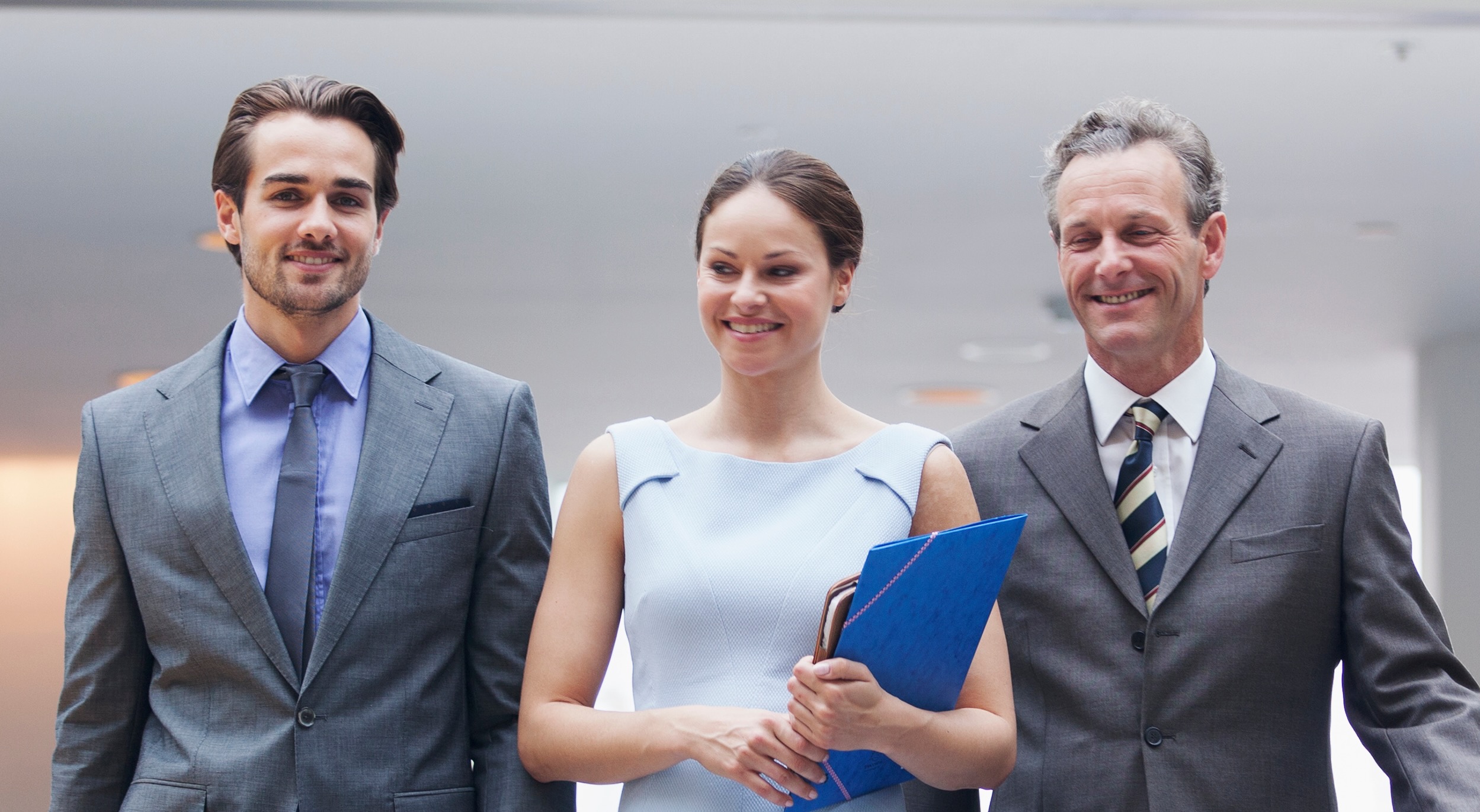 A man and woman looking at a laptop together reviewing employee benefits